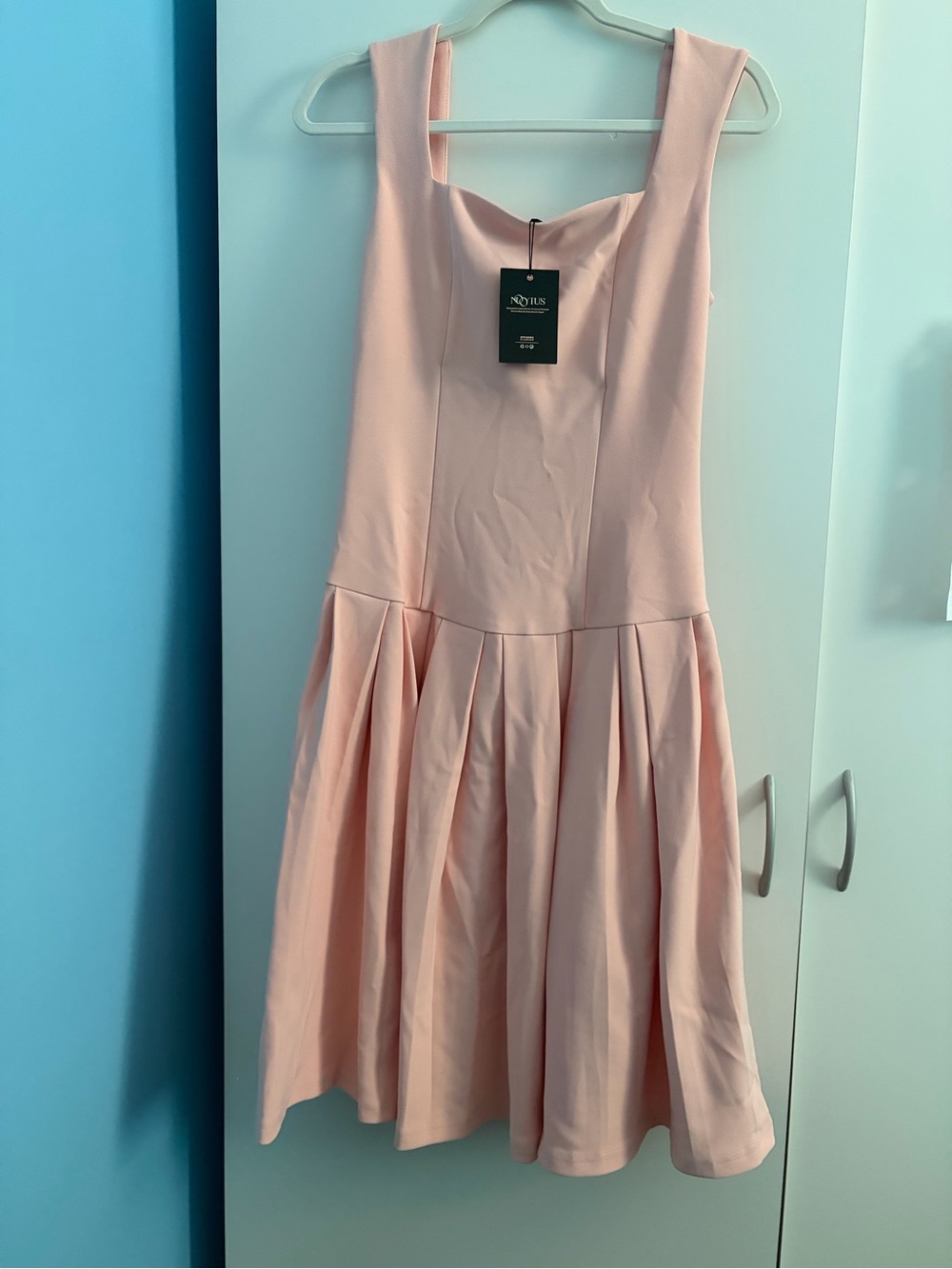 Sleeveless Blush Midi Dress with Pleated Skirt